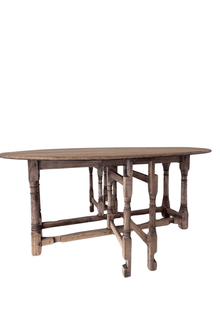 Antique Belgian oak gateleg dining table with an oval drop-leaf top and turned spindle legs, in a bleached weathered finish