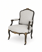 Louis XV-style armchair, black-painted with gilt floral carving and cabriole legs, upholstered in white and black pinstripe fabric