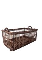 Angled view of the willow panetierre showing its open woven interior and slatted base construction